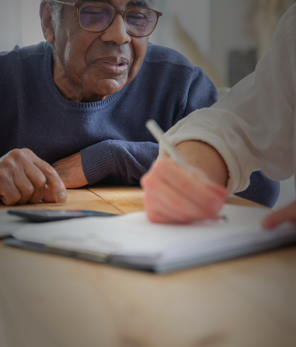 Red pedestrian stop signal at a traffic light.