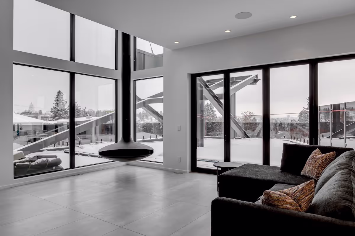 Living area featuring custom window bench cabinetry, minimalist storage, and modern millwork elements. Cabinetry by Marvel Cabinetry.