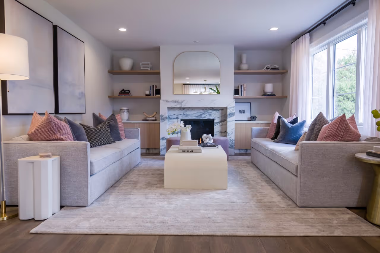 Cozy living room with custom built-ins, fireplace millwork, and modern shelving featured in Viola Davis’ Celebrity IOU home reveal. Cabinetry by Marvel Cabinetry for HGTV’s Property Brothers: Celebrity IOU - Viola Davis