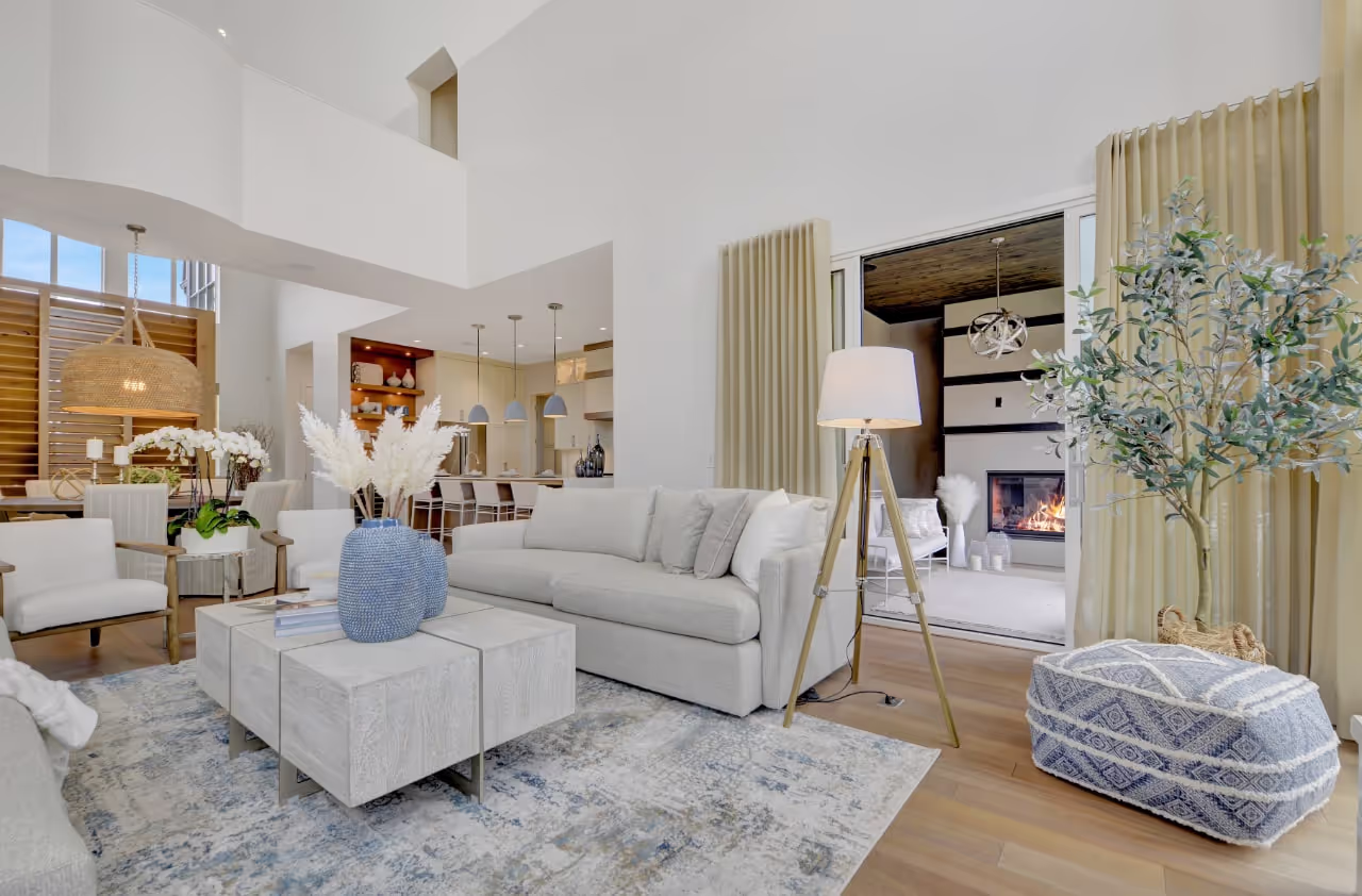 Elegant living room with custom built-ins, decorative shelving, and coordinated cabinetry accents. Cabinetry by Marvel Cabinetry.
