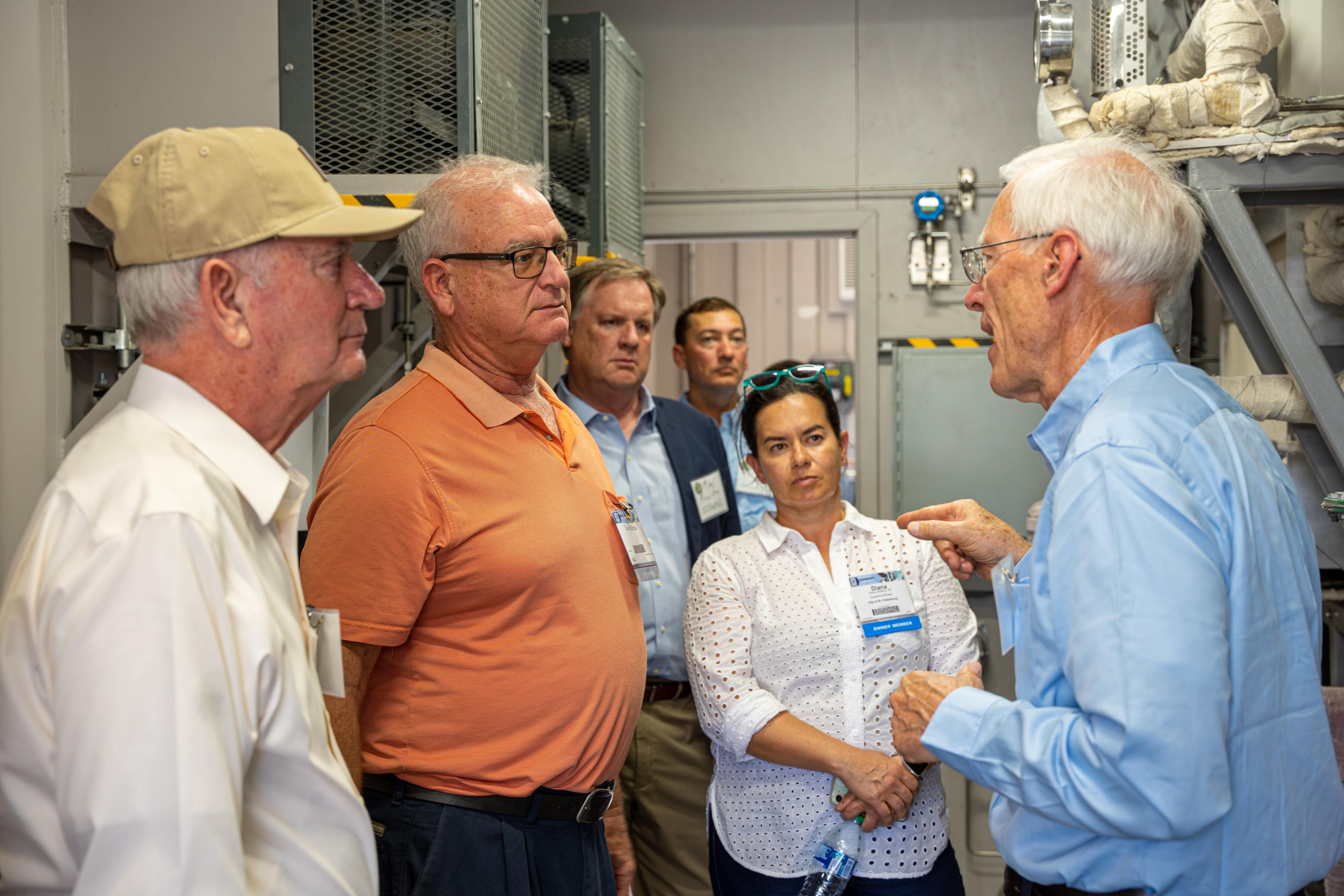 Man gives a tour of the equipment used to turn biosolids to biofuel