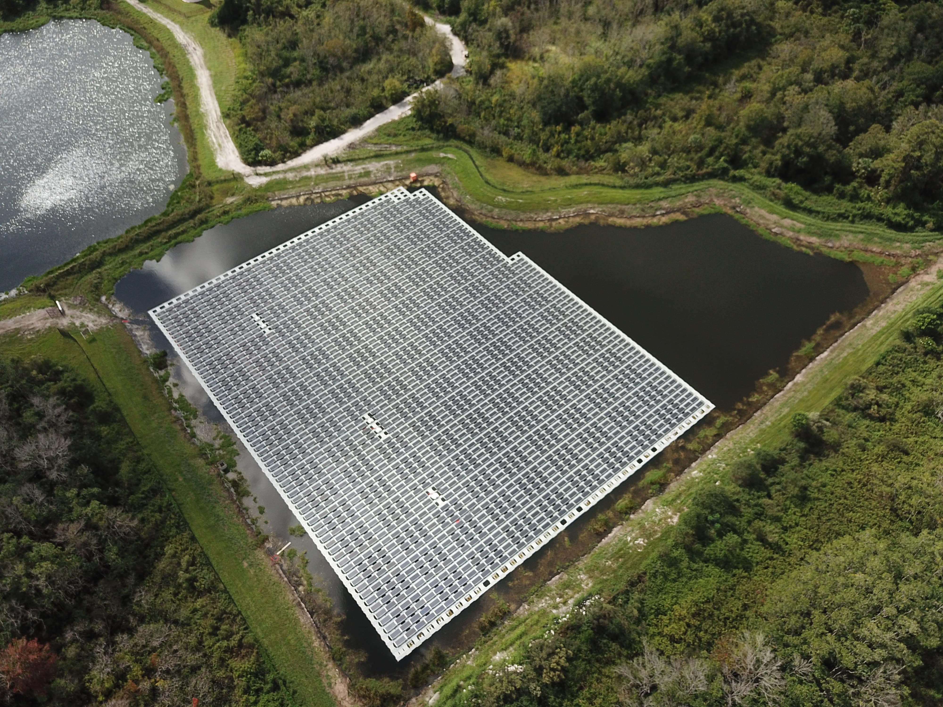 Aerial view of solar panels in a pond