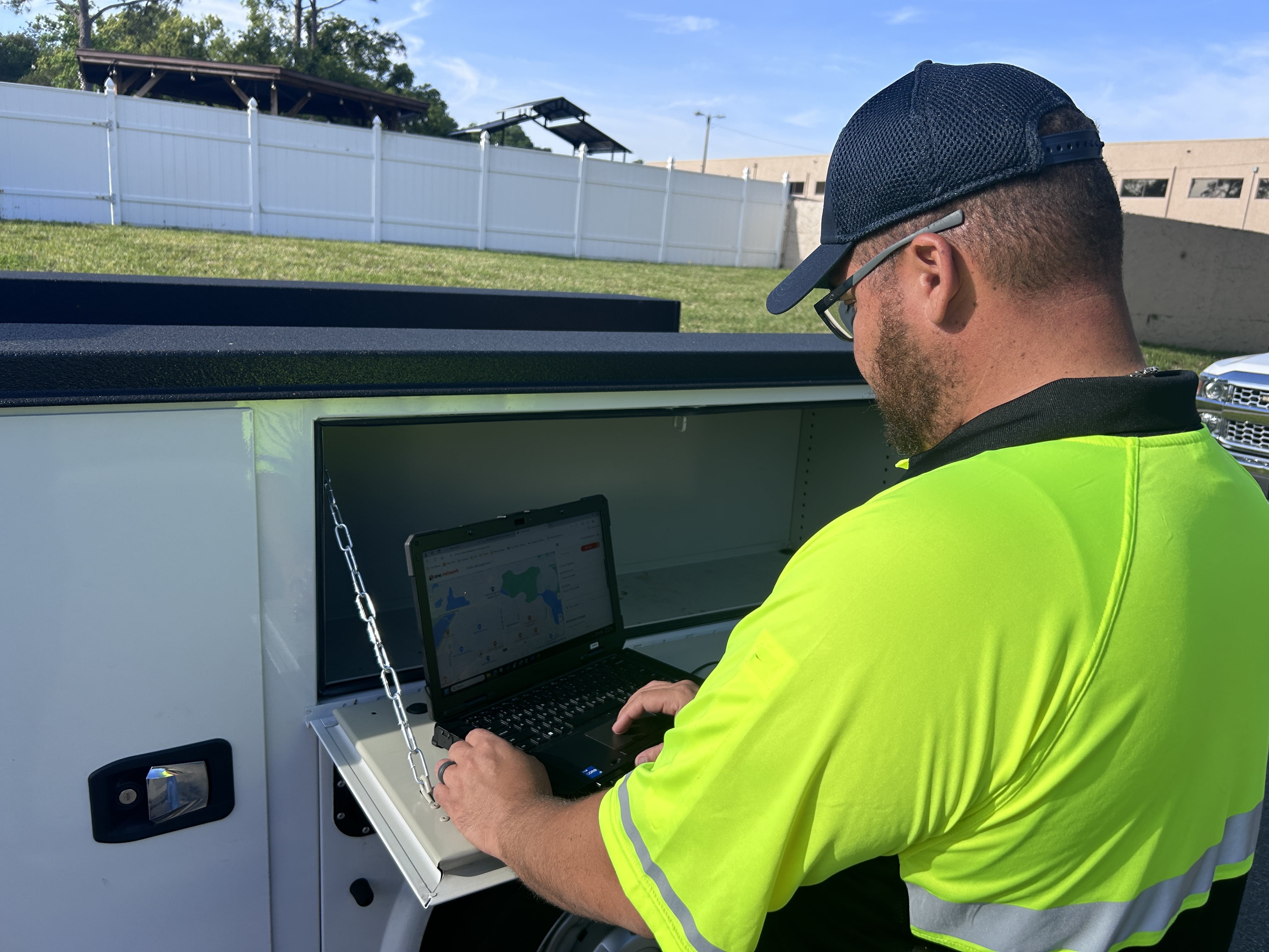 City staff member entering road condition information into a computer