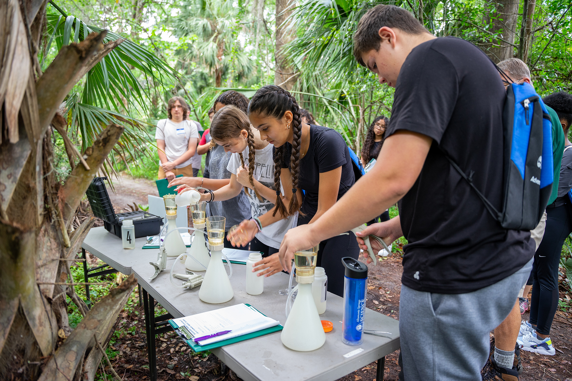 Students conducting experiments in the park
