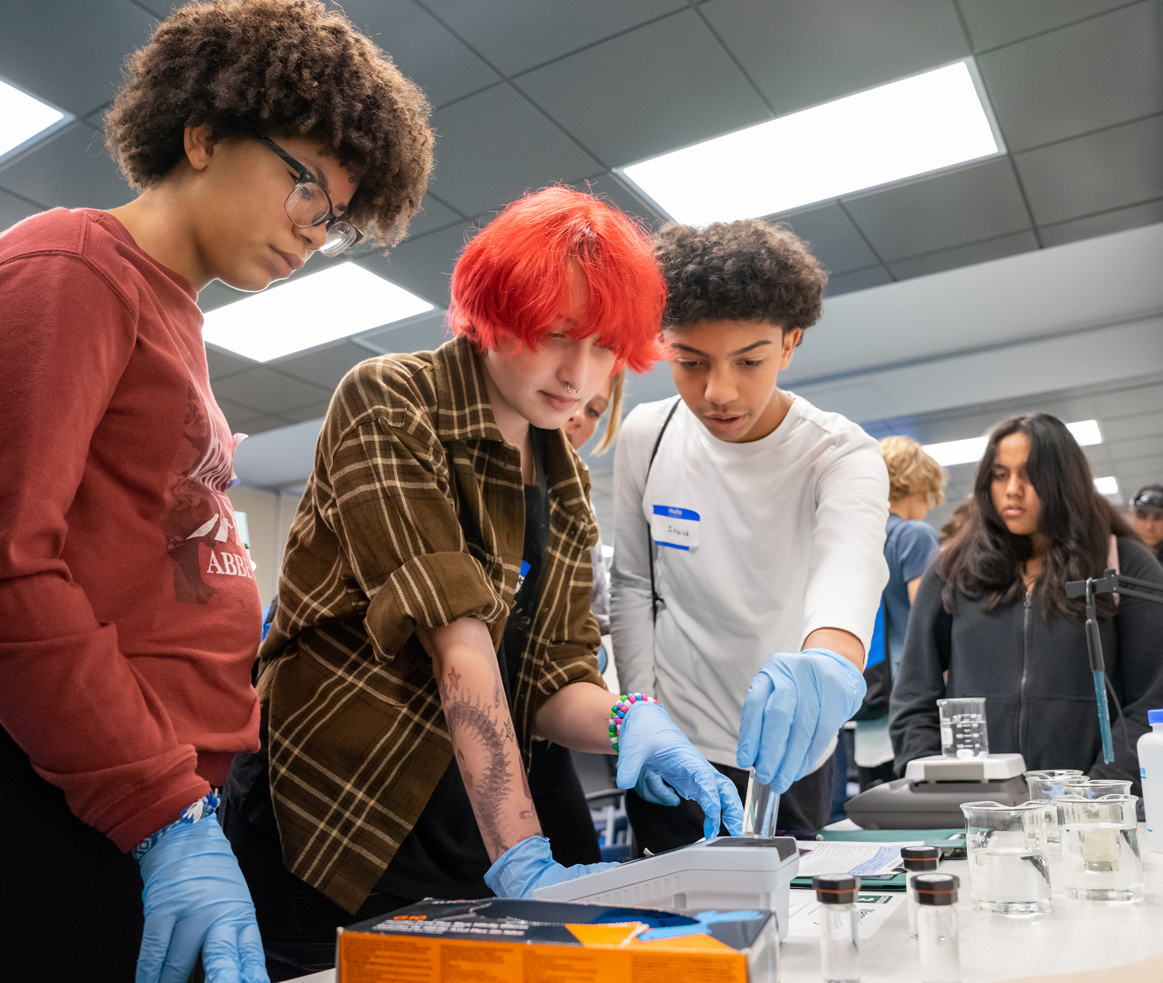 Students in AS2I classroom conducting an experiment