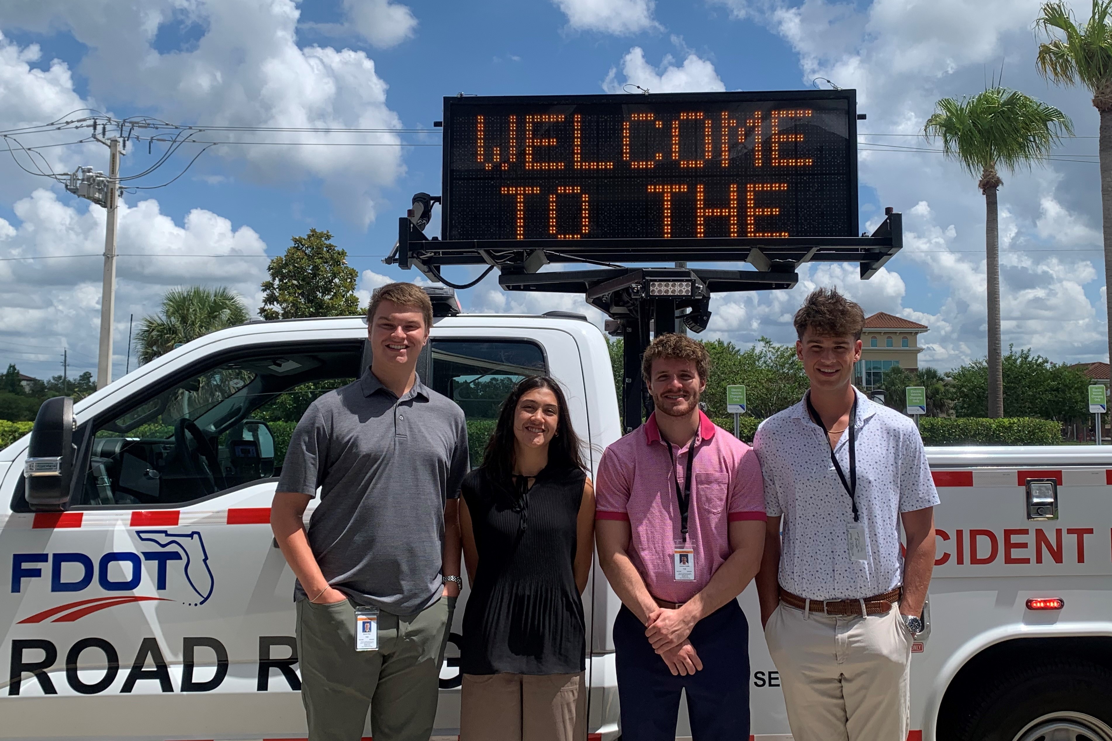 FSU student interns post in front of an FDOT Road Ranger truck