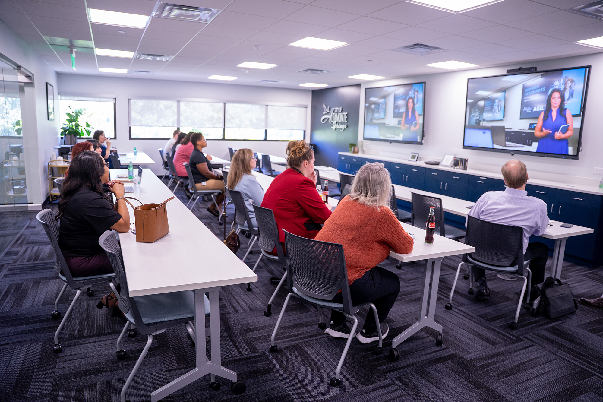 Wide angle of classroom with participants gathered for an event