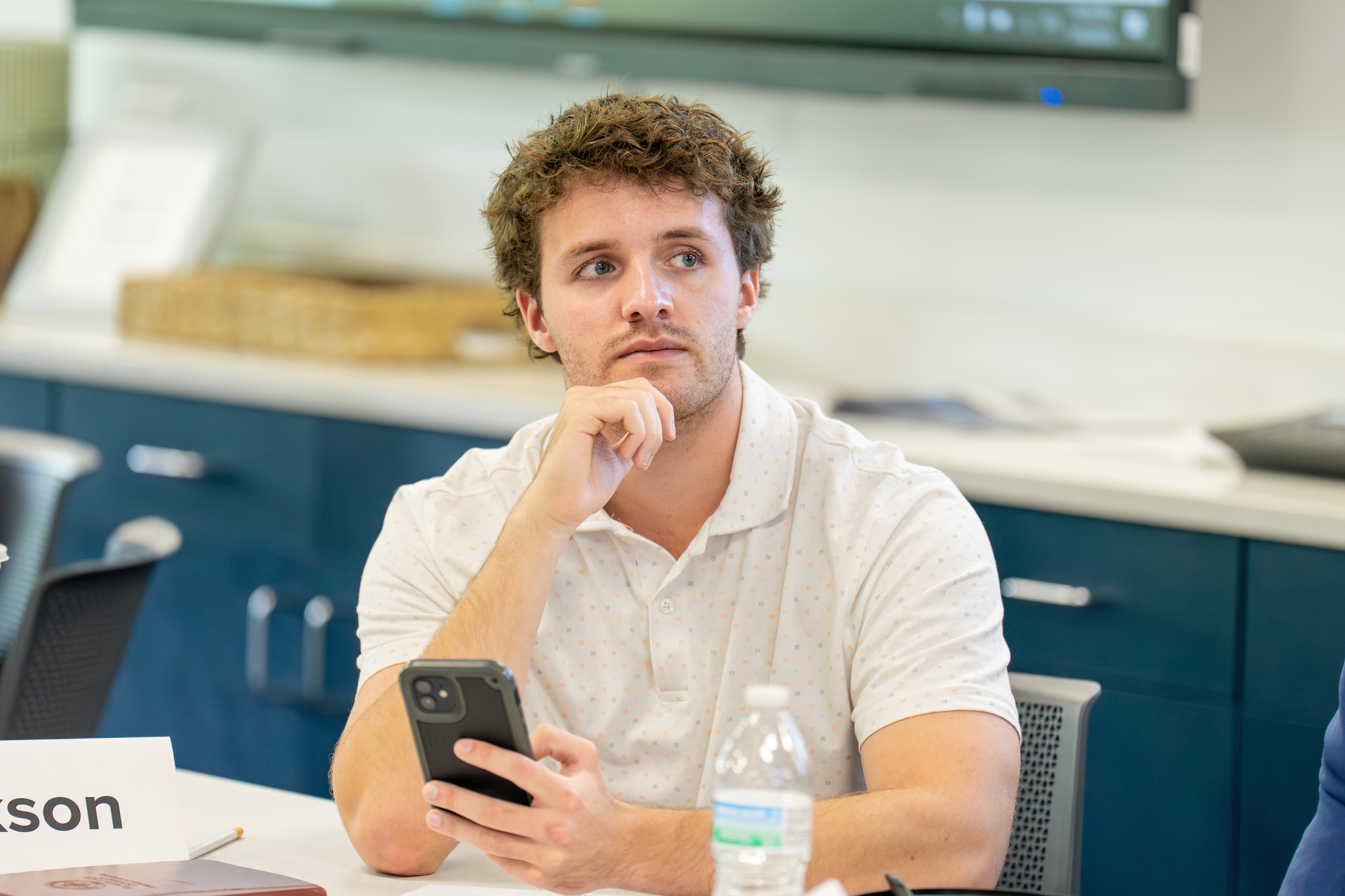 College student intern listens intently during a team-building workshop
