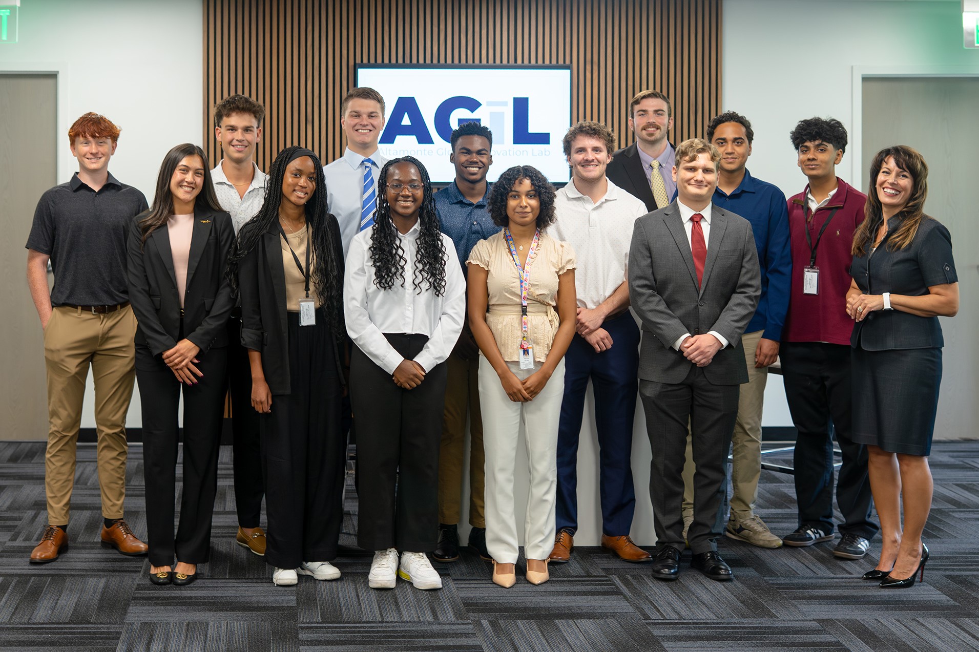 Student summer interns pose in a group after a lunch and learn presentation