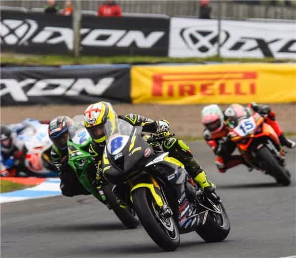 Motorcycle racers compete on track during high-speed superbike championship