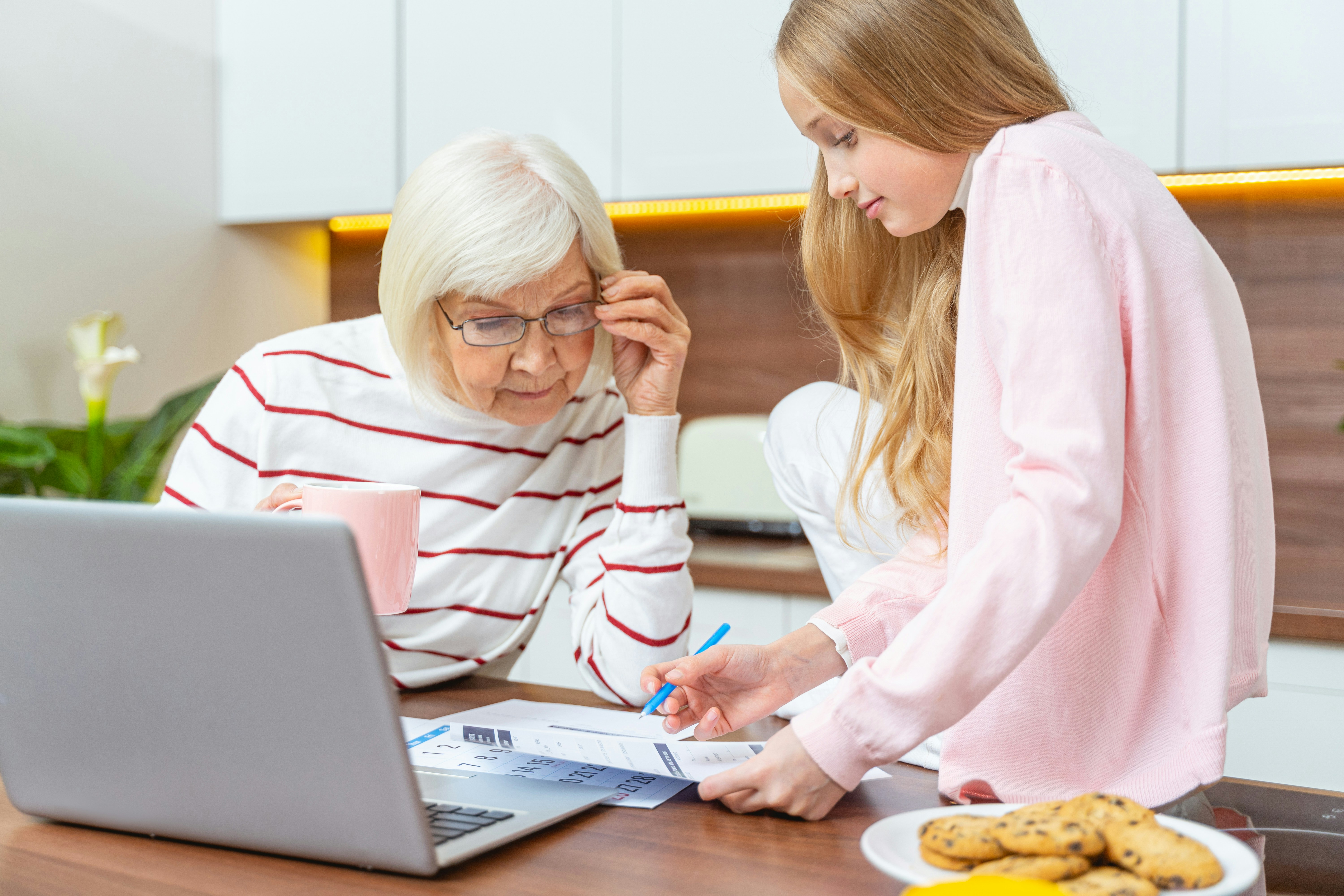 Grandma with granddaughter on laptop