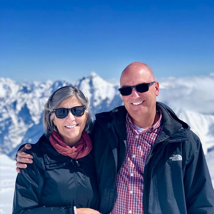Crown Telecom owners pictured in front of a mountain range.