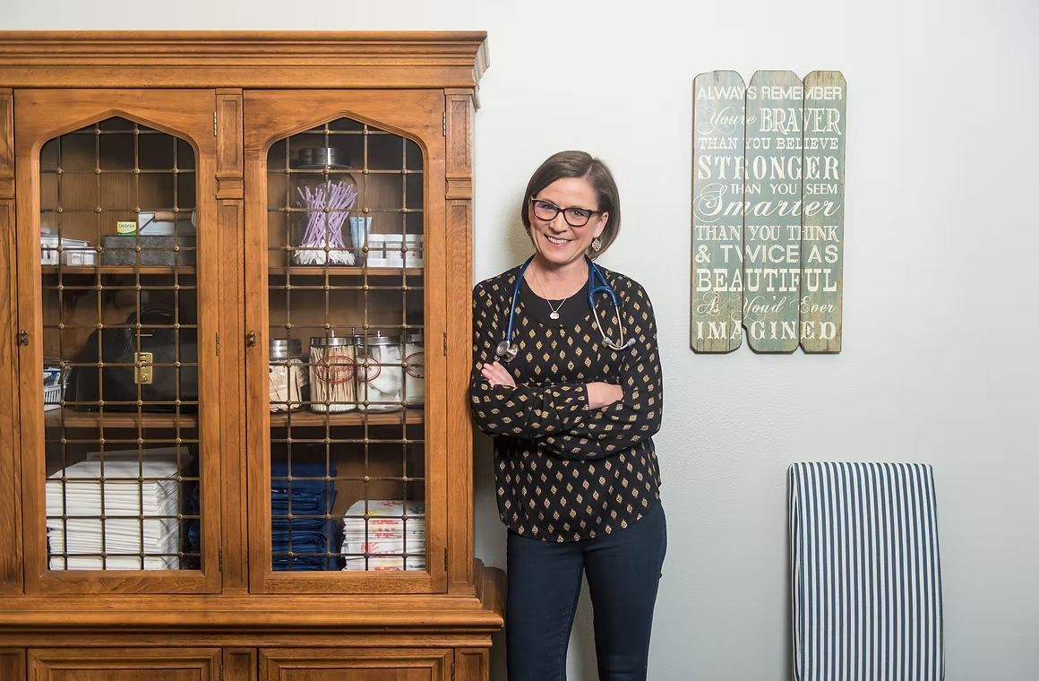 Dr. P standing in the exam room at Homestead Family Medicine.