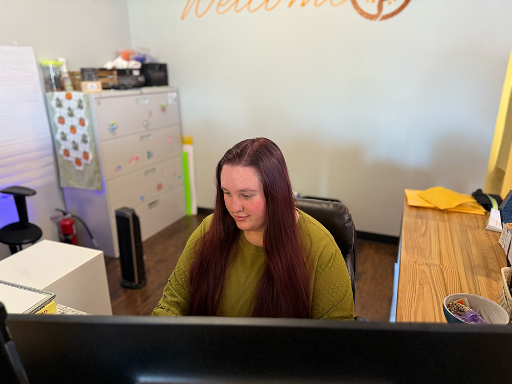 Maisie at the front desk of Homestead Family Medicine