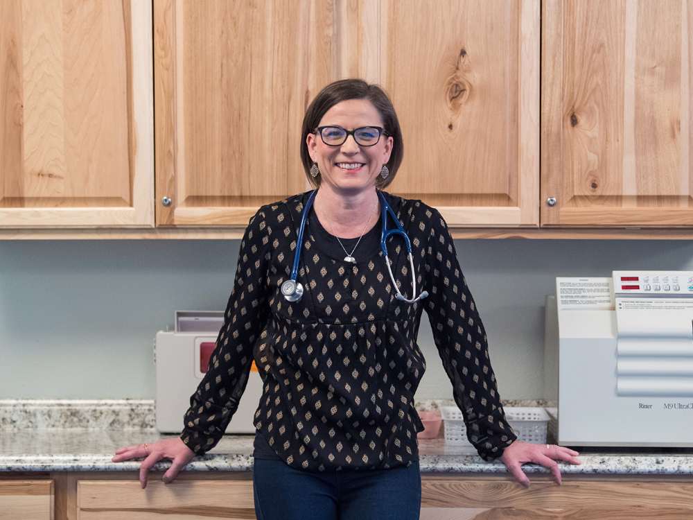 Dr. P standing in the entry at Homestead Family Medicine.