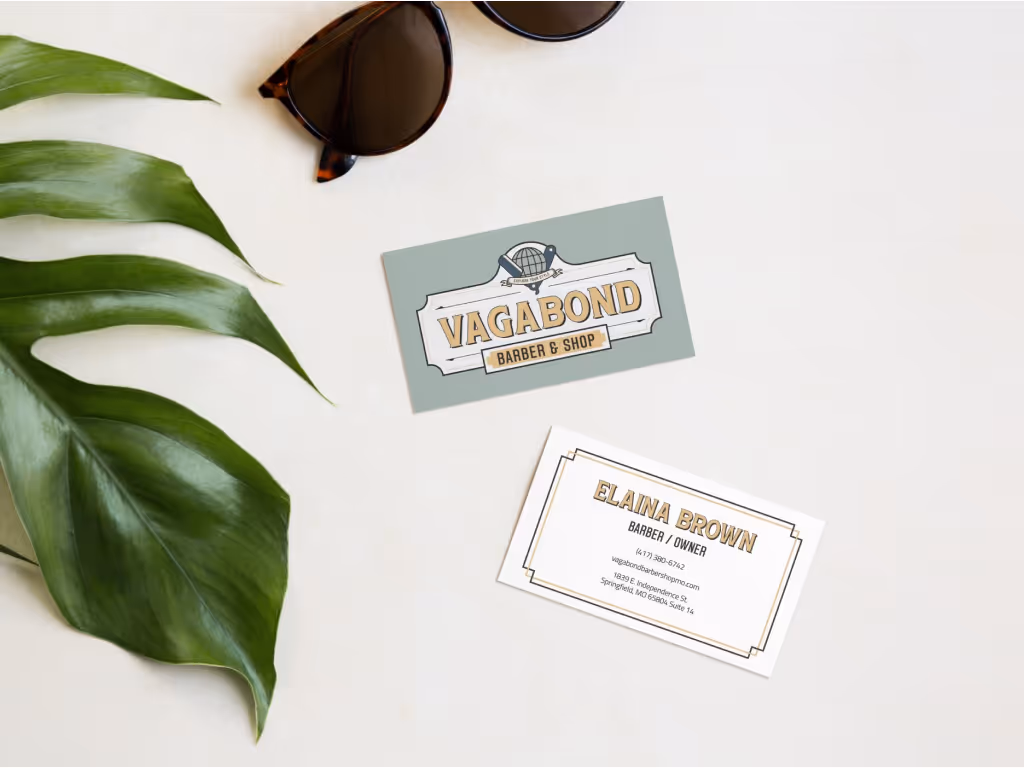 The Vagabond business card just chilling with a leaf and some sunglasses