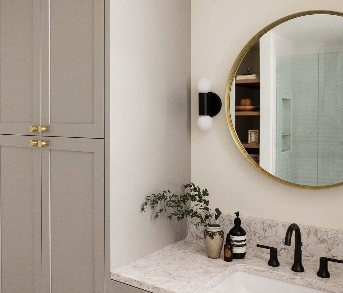 Sophisticated Neutral Bathroom Vanity Design with warm grey and matte black and gold accents.