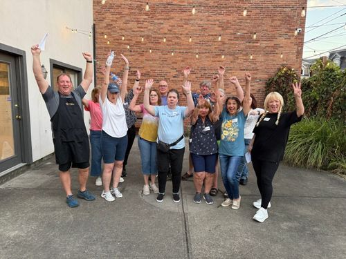 Group of volunteers excited after hitting a milestone