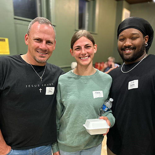 Group of three people serving