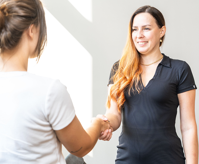 Charlotte tax preparer greeting a client during an appointment.