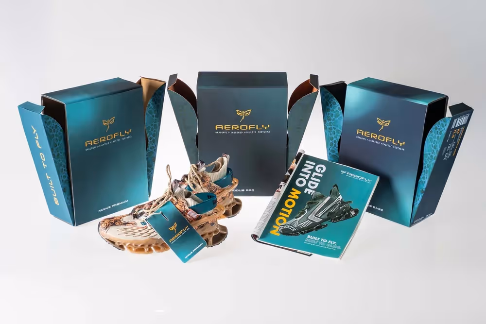 Teal product boxes and pouches arranged with snacks on white background, product photography by Photos by Lars.