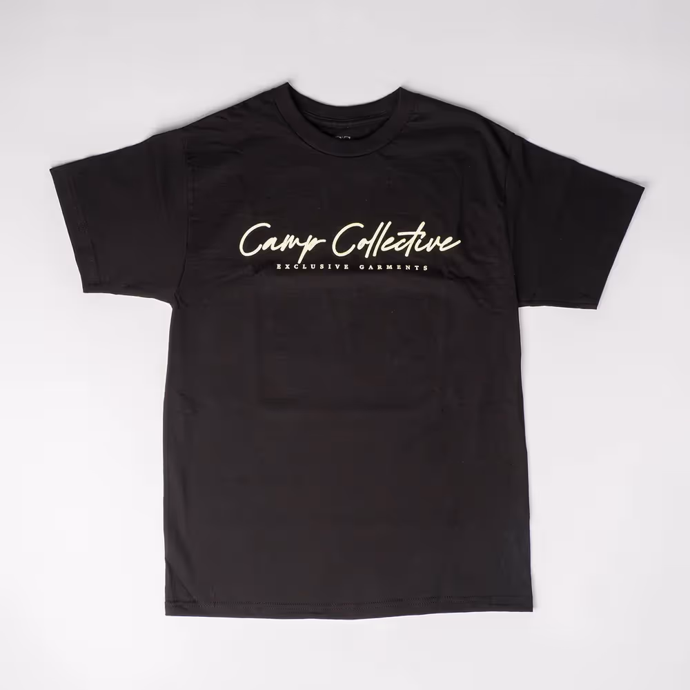 Close-up embroidery reading 'greater things' on green fabric, apparel detail photography by Photos by Lars.