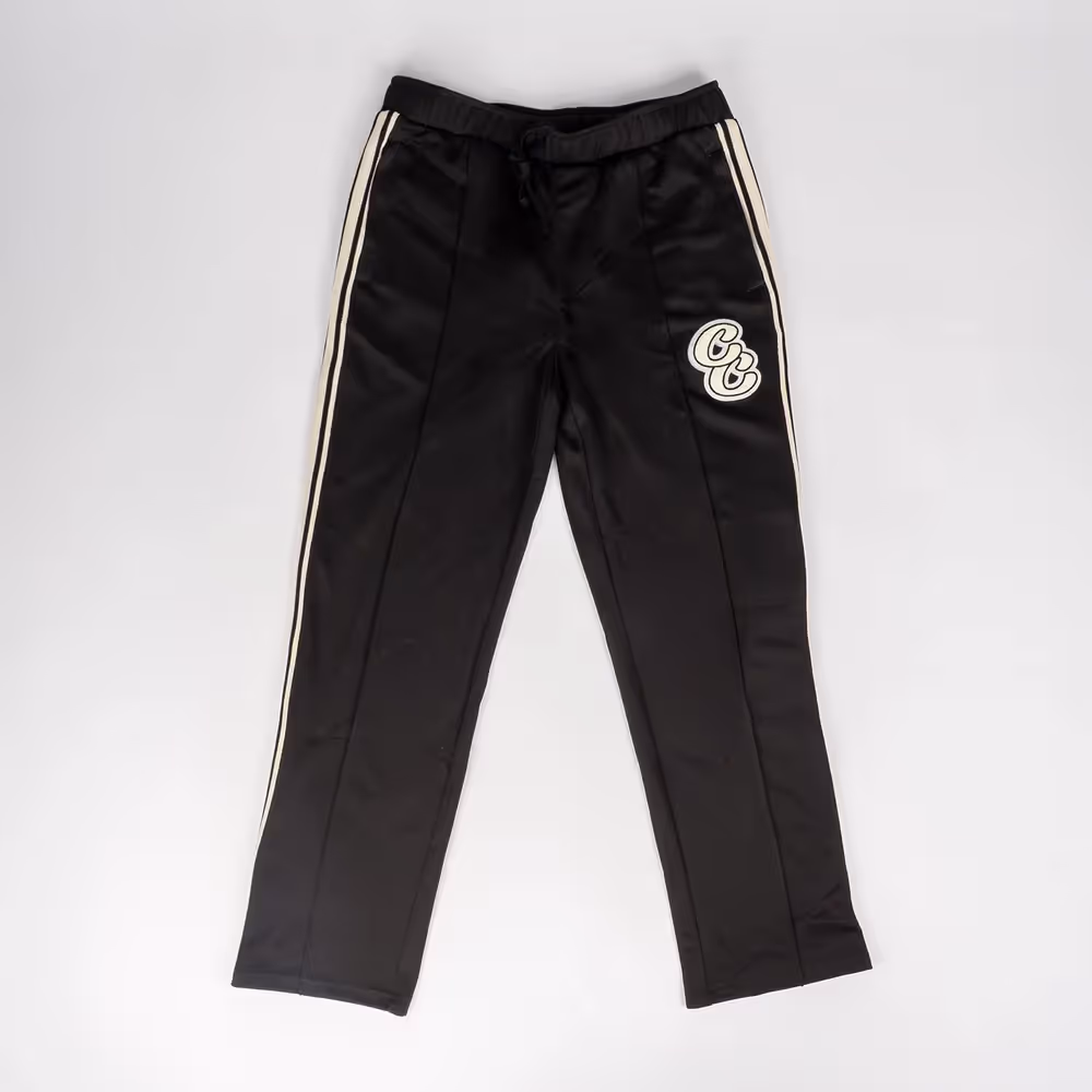 Black Camp Collective sweatpants laid flat with logo patch on thigh, ecommerce photography by Photos by Lars.