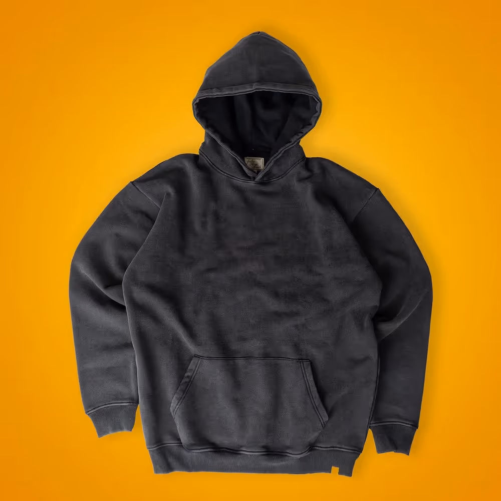 Charcoal Grater Things hoodie laid flat on yellow background, ecommerce apparel photography by Photos by Lars.