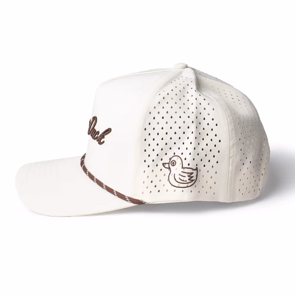White perforated trucker cap with duck embroidery and brown trim on white, ecommerce photography by Photos by Lars.