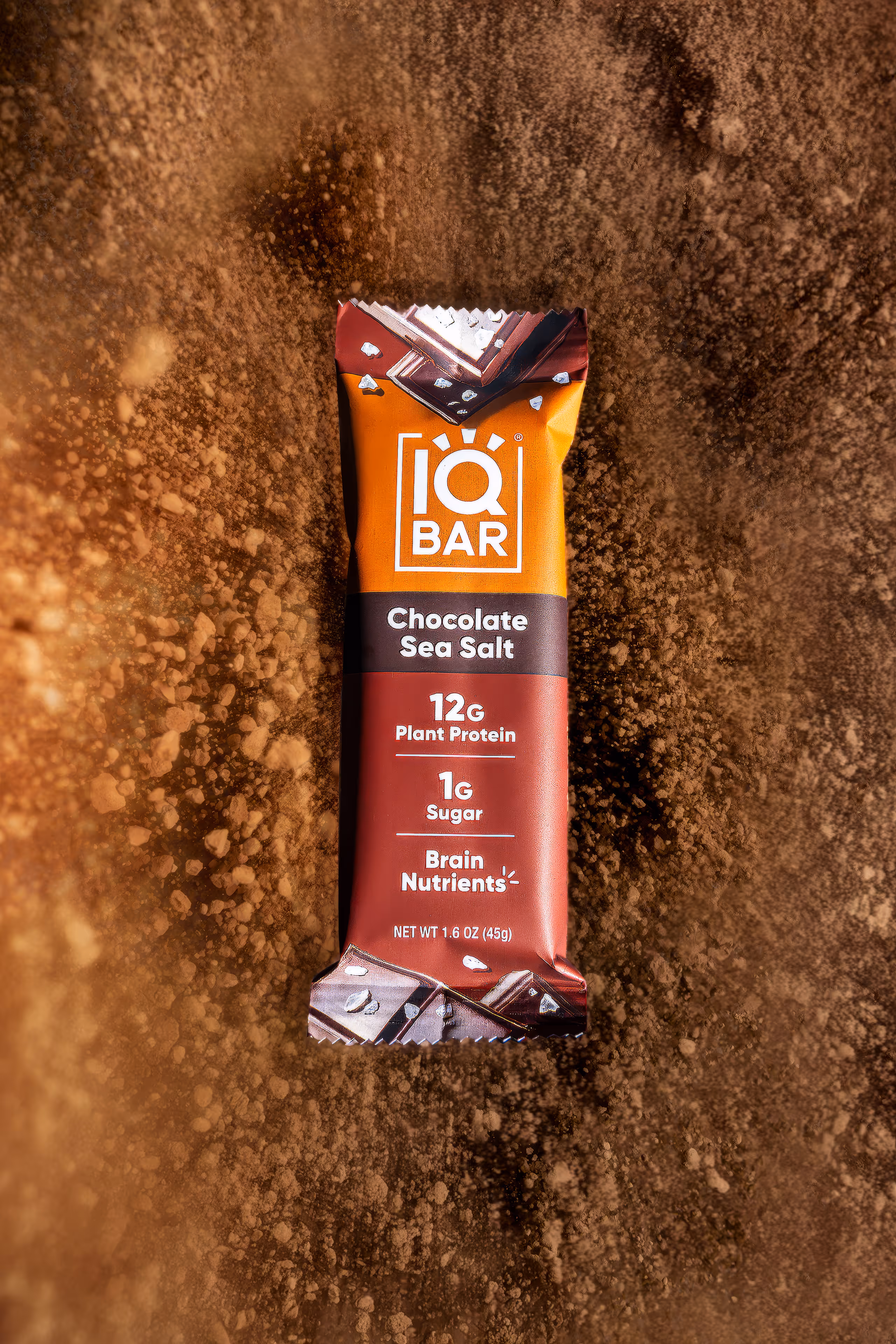 IQBAR Chocolate Sea Salt bar on brown powder background, food photography by Photos by Lars.