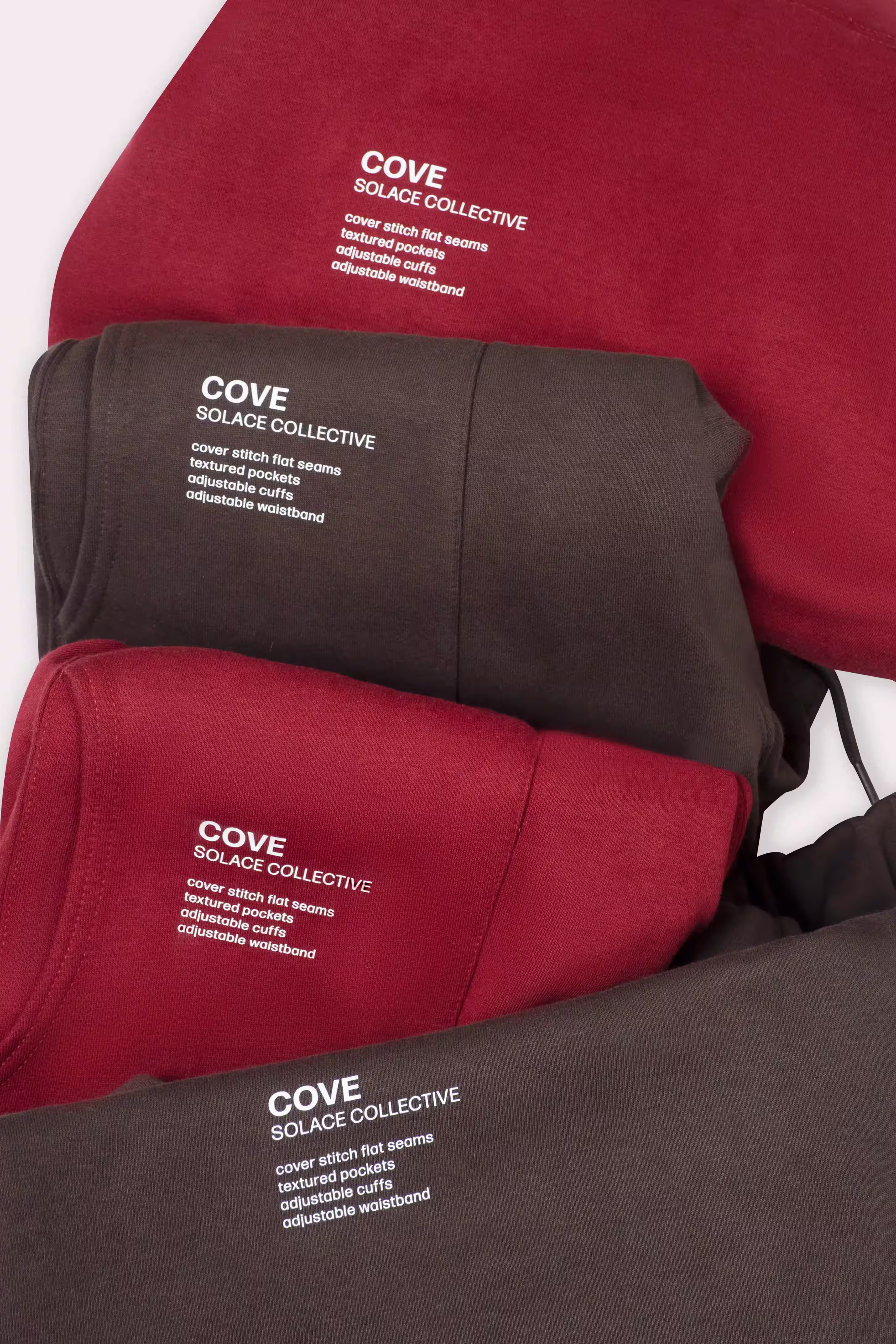 Stacked red and brown SOLACE garment tags and labels in close-up, product detail photography by Photos by Lars.