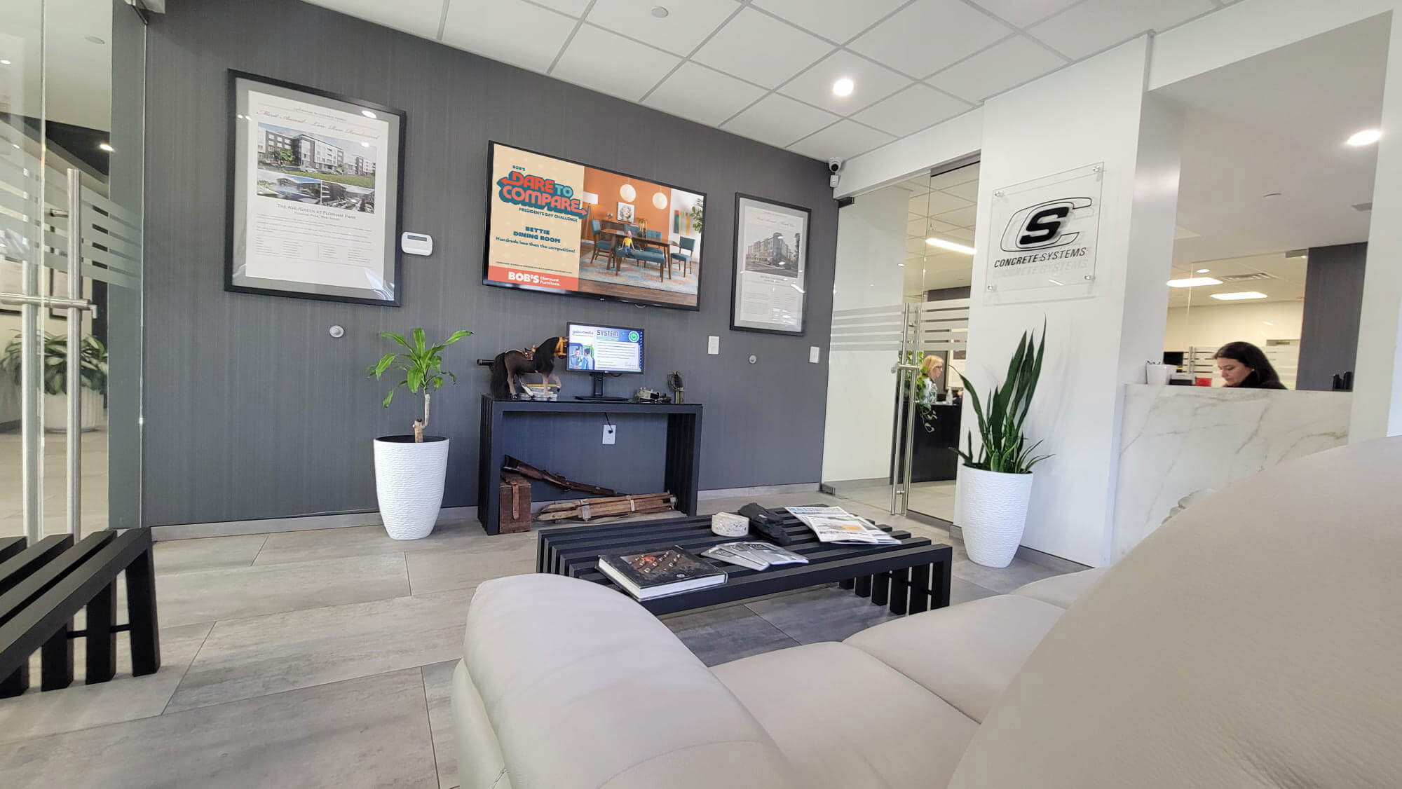 An office lounge with Gabi Media's screens featured prominently