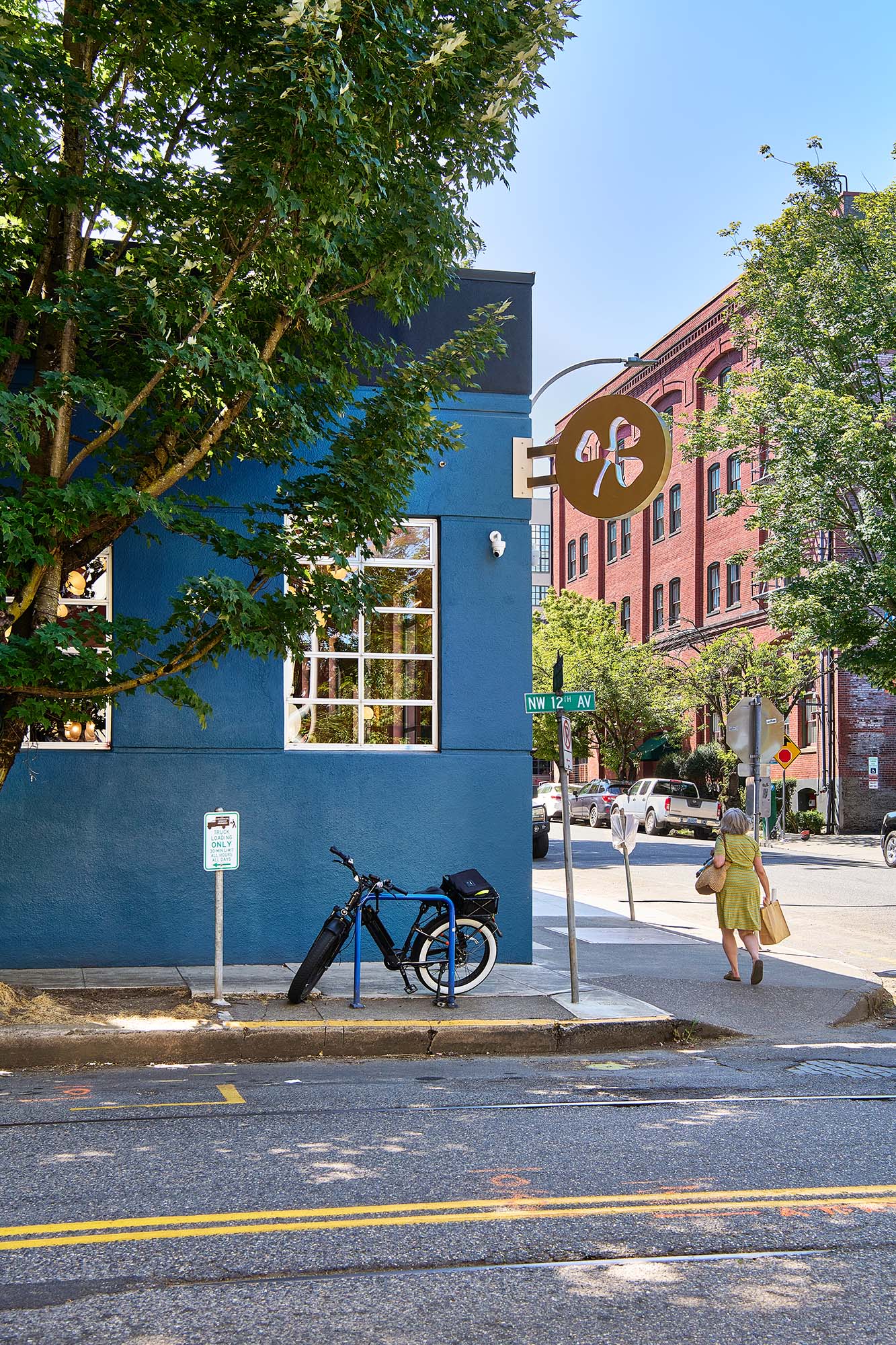 Exterior of The Malarkey in Portland’s Pearl District, showing the restaurant’s blue facade and signage at NW 12th Avenue