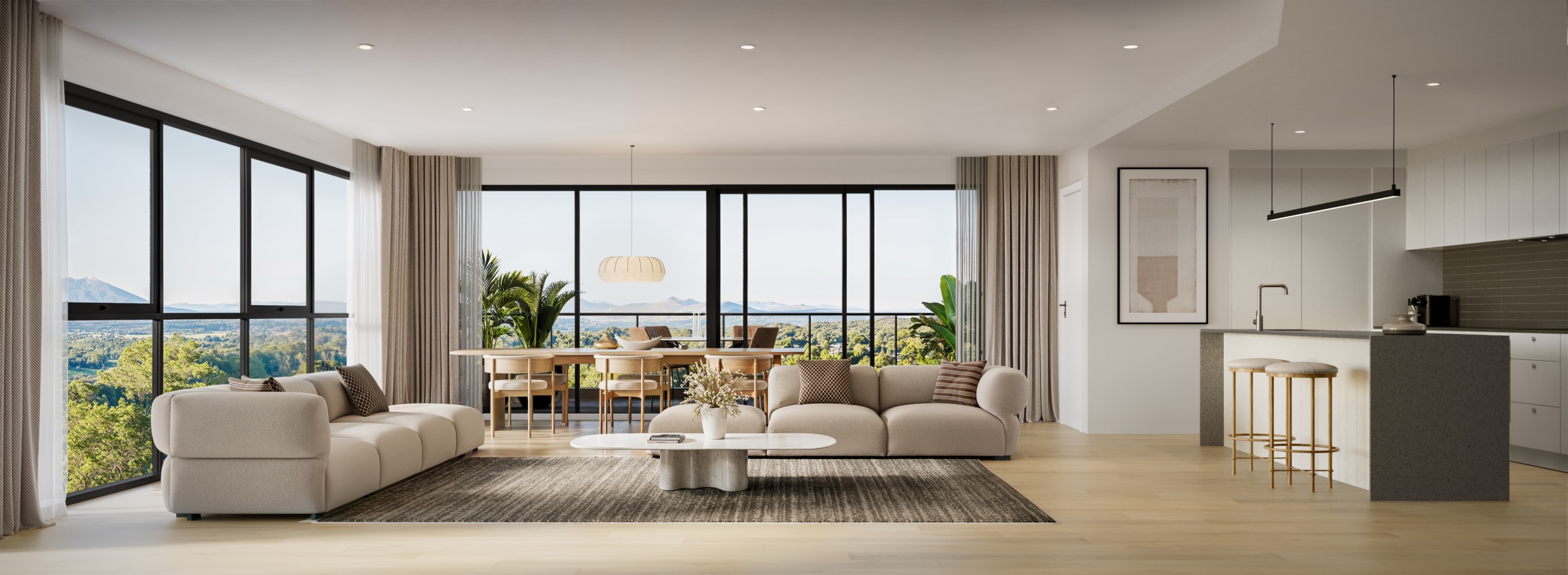 Bright modern open living room with beige sofas, dining table, large windows with mountain and forest view, and a kitchen island with stools.