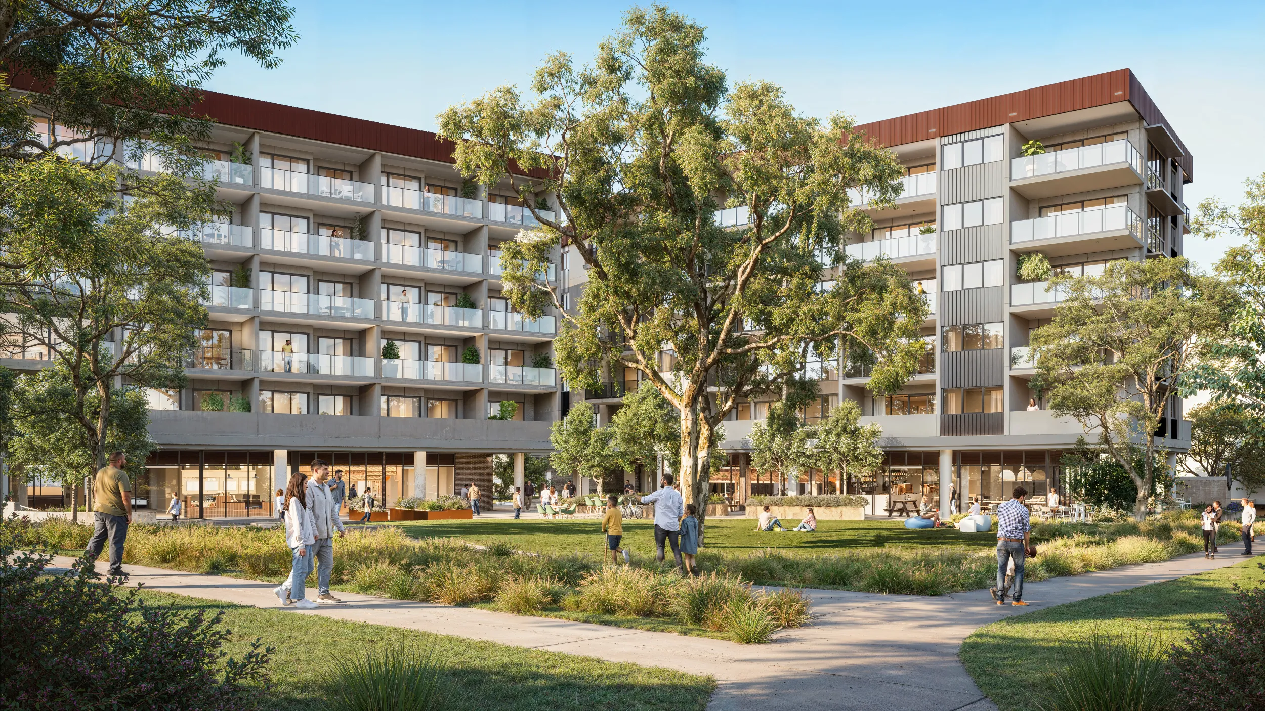 Modern apartment building with balconies overlooking a landscaped park where diverse people walk, sit, and socialize under large trees.
