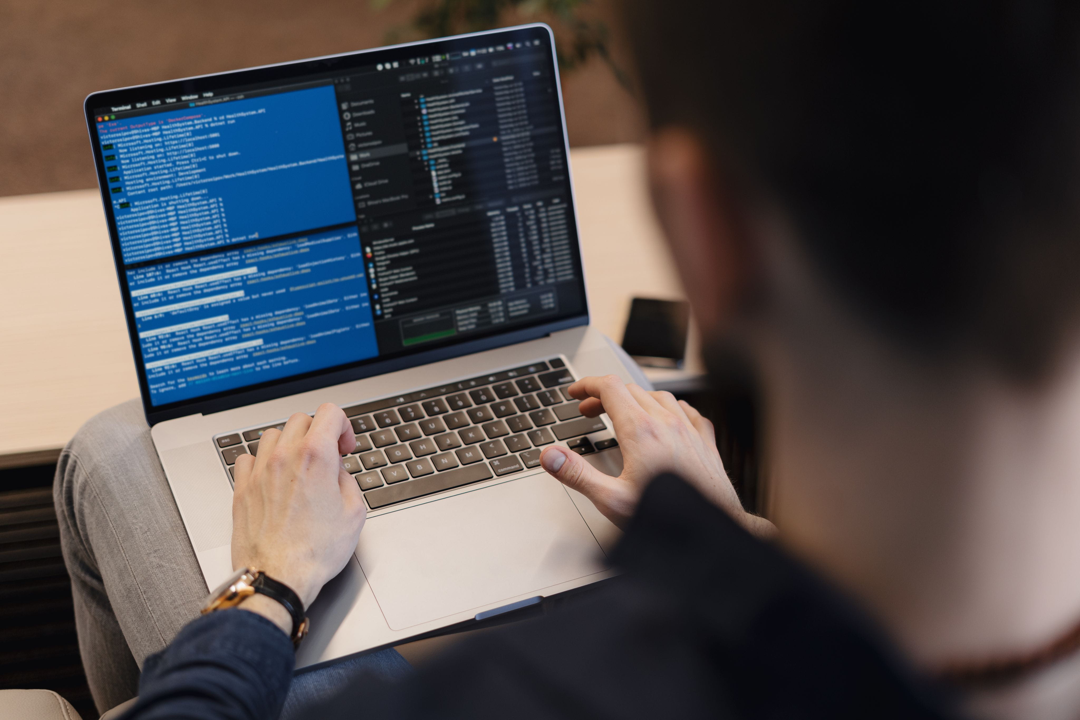 Developer coding on a laptop