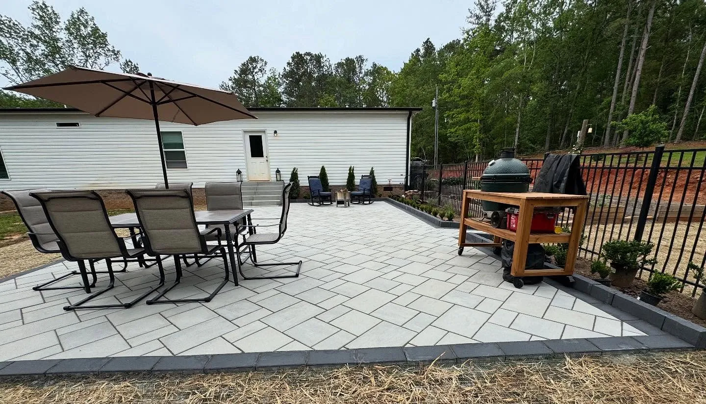 Backyard View with  Barbecue Grill and Chairs