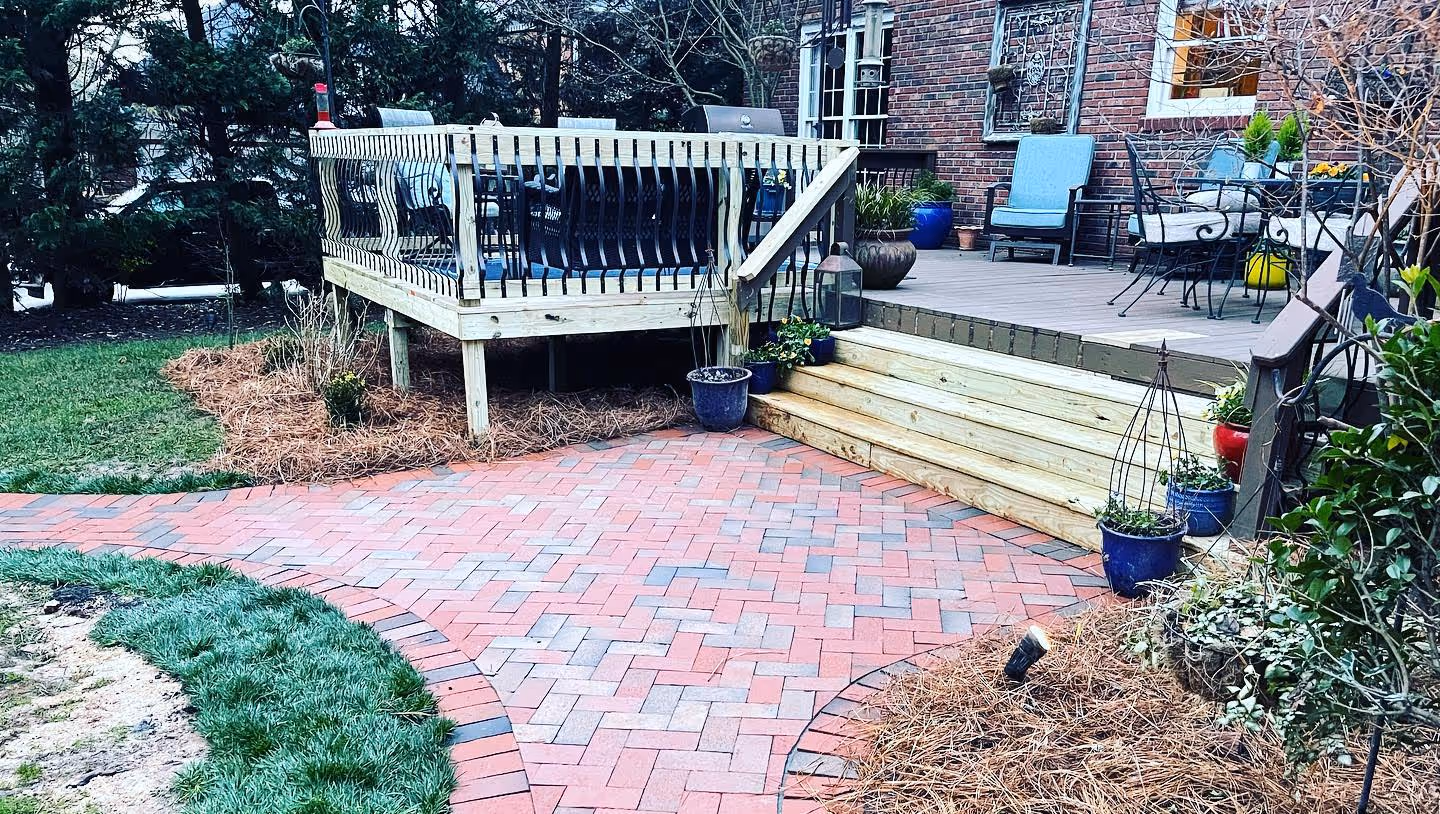 Backyard deck with wooden railings