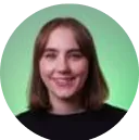 Portrait of a smiling woman with shoulder-length brown hair wearing a black top against a gradient green background.