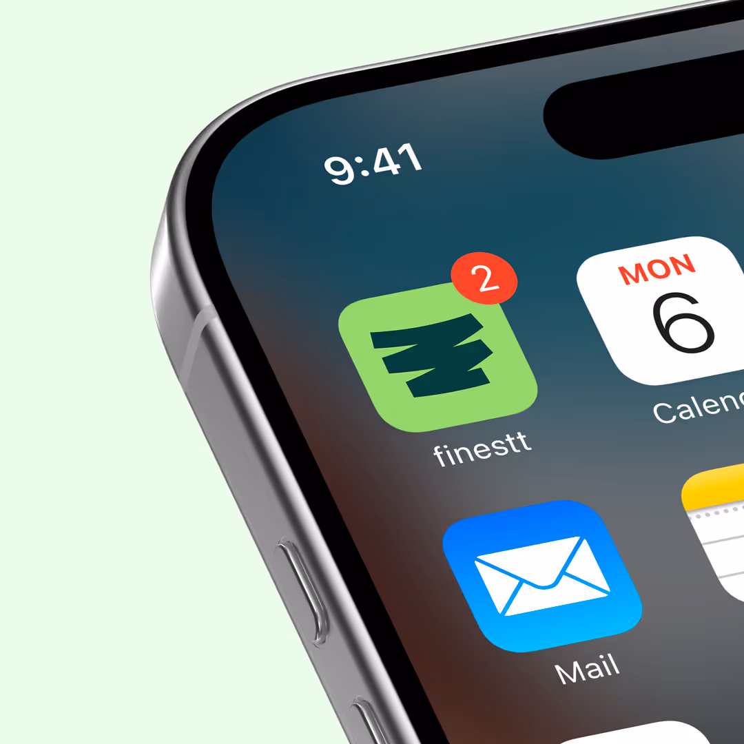 Close-up of iPhone screen showing app icons for finestt with 2 notifications, Calendar displaying Monday the 6th, and Mail app at 9:41.