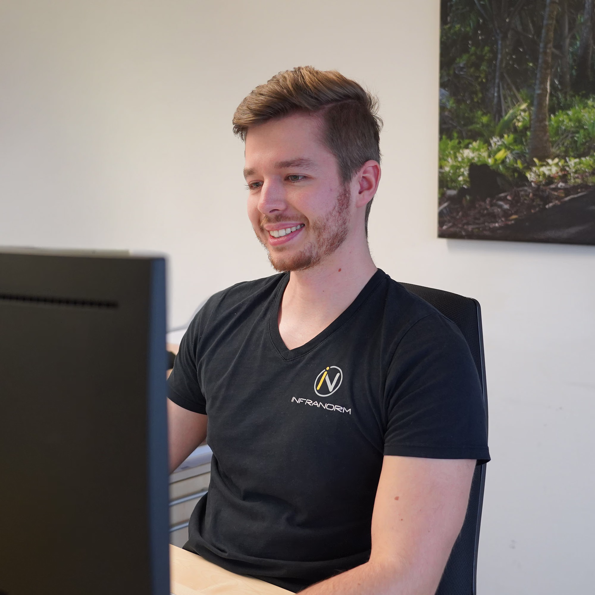 Two Infranorm workers work on the roof of a building