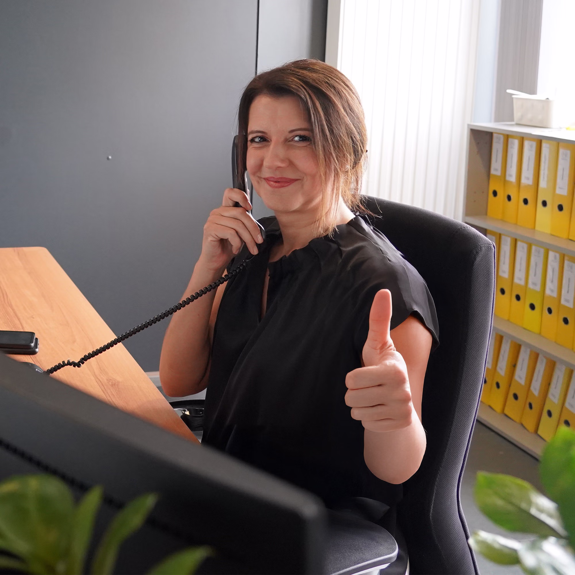 Two Infranorm workers work on the roof of a building