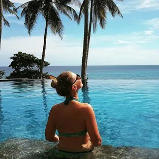 Woman in a pool in an exotic environment.