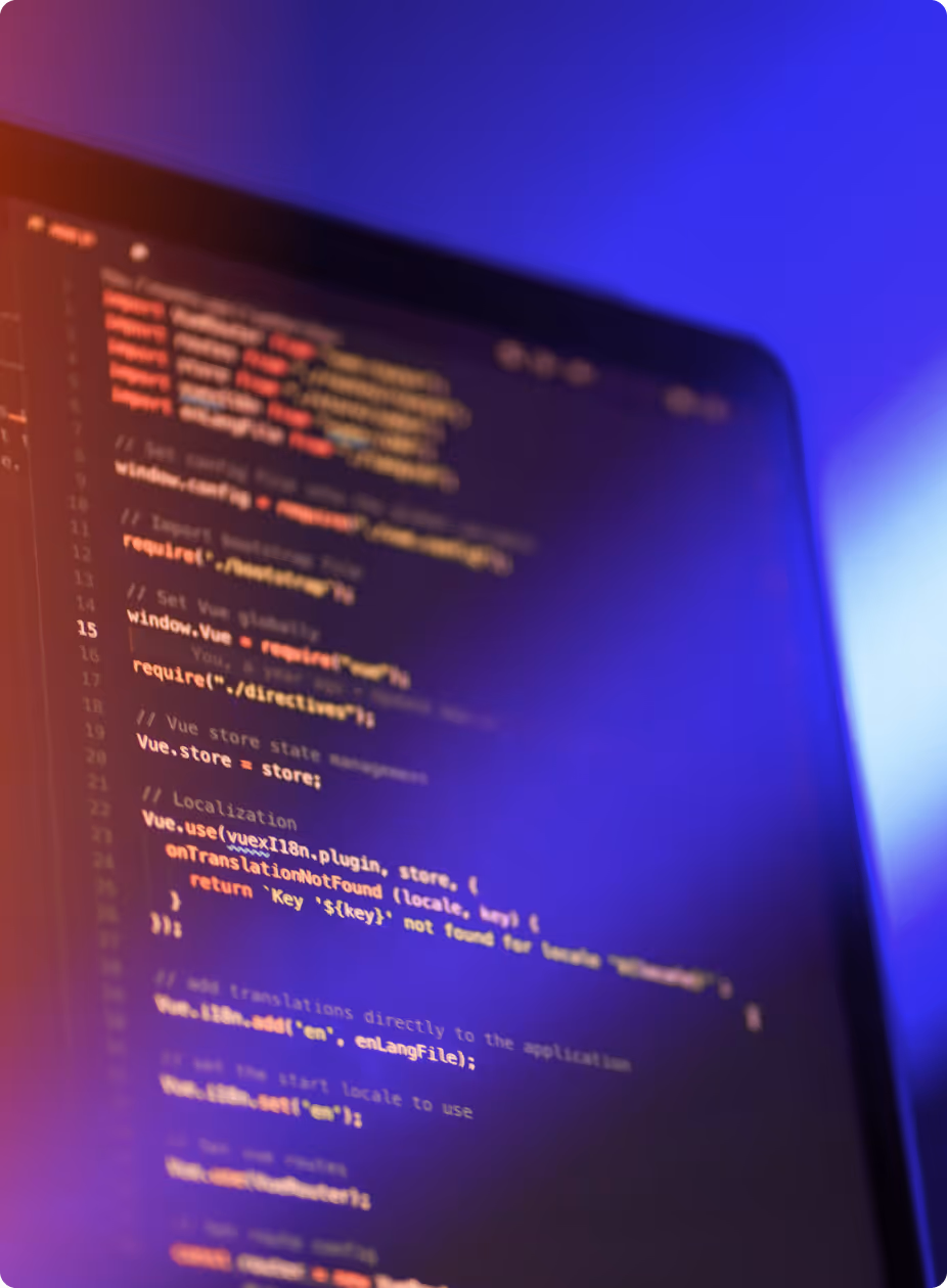 Close-up of a computer screen displaying colorful Vue.js source code with a blue and purple gradient background.
