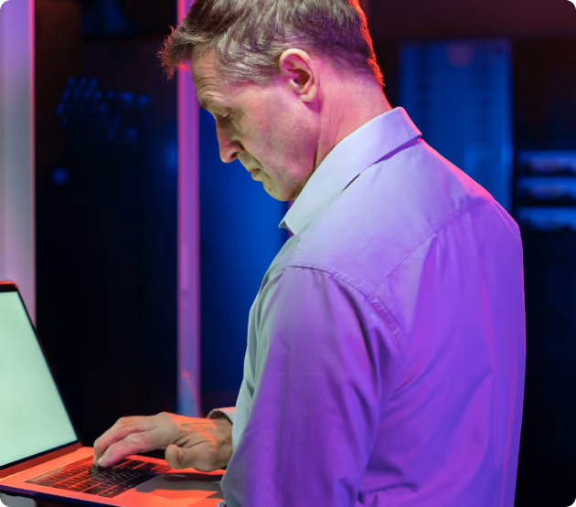Cybersecurity expert performing penetration testing on a laptop