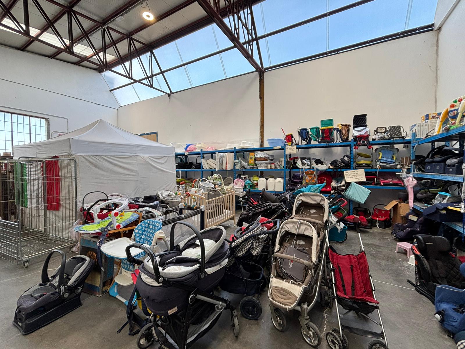 image of volunteers sorting clothes at a donation center for a humanitarian aid nonprofit