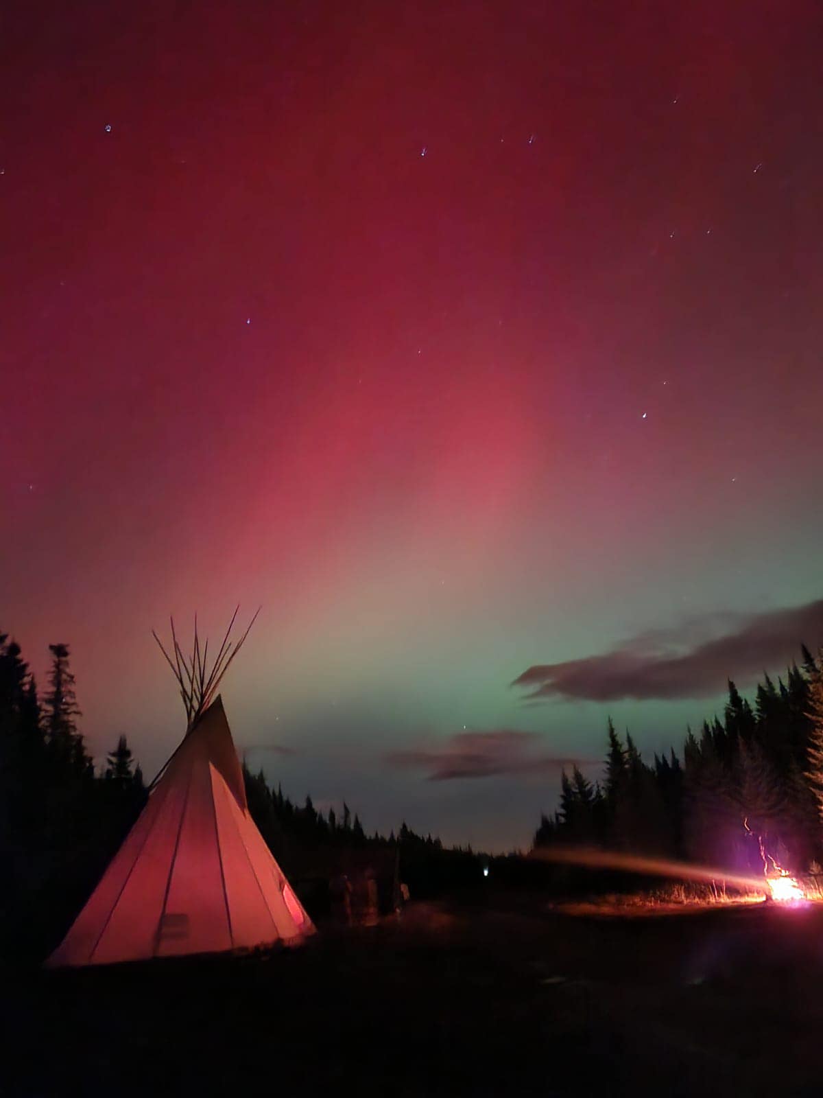 Photo of a Wigwam and campfire in Eskasoni First Nation
