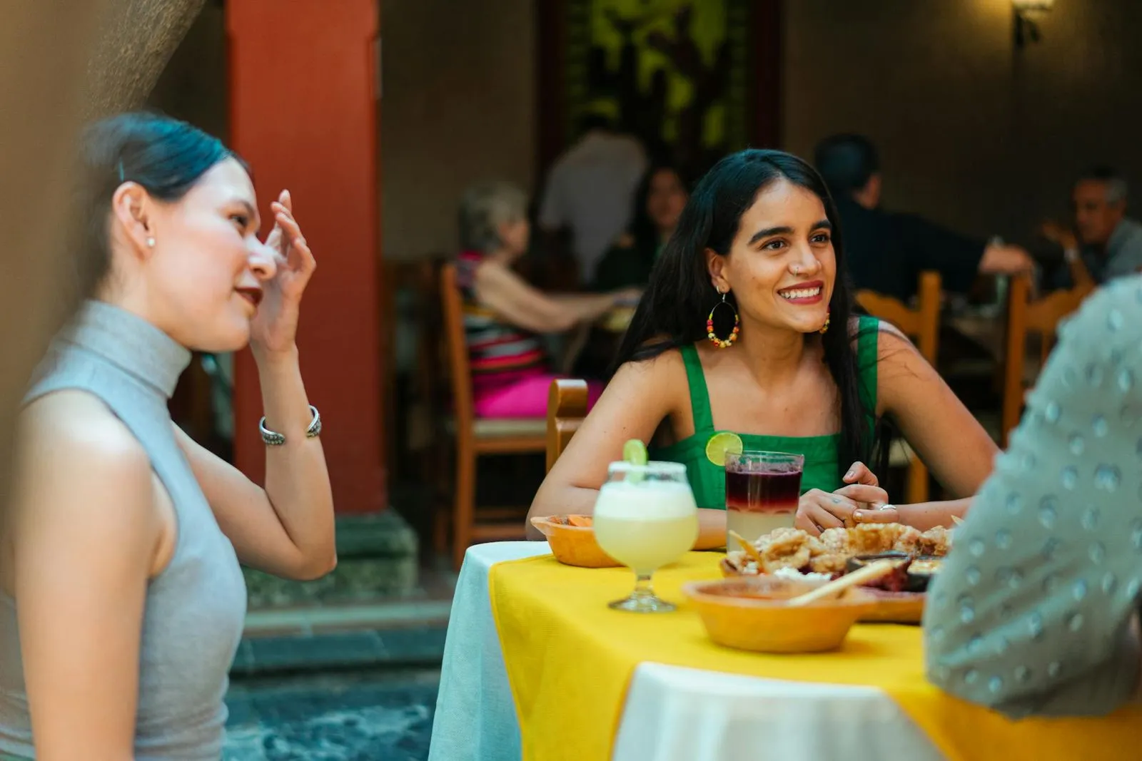 Woman enjoying meal with friends