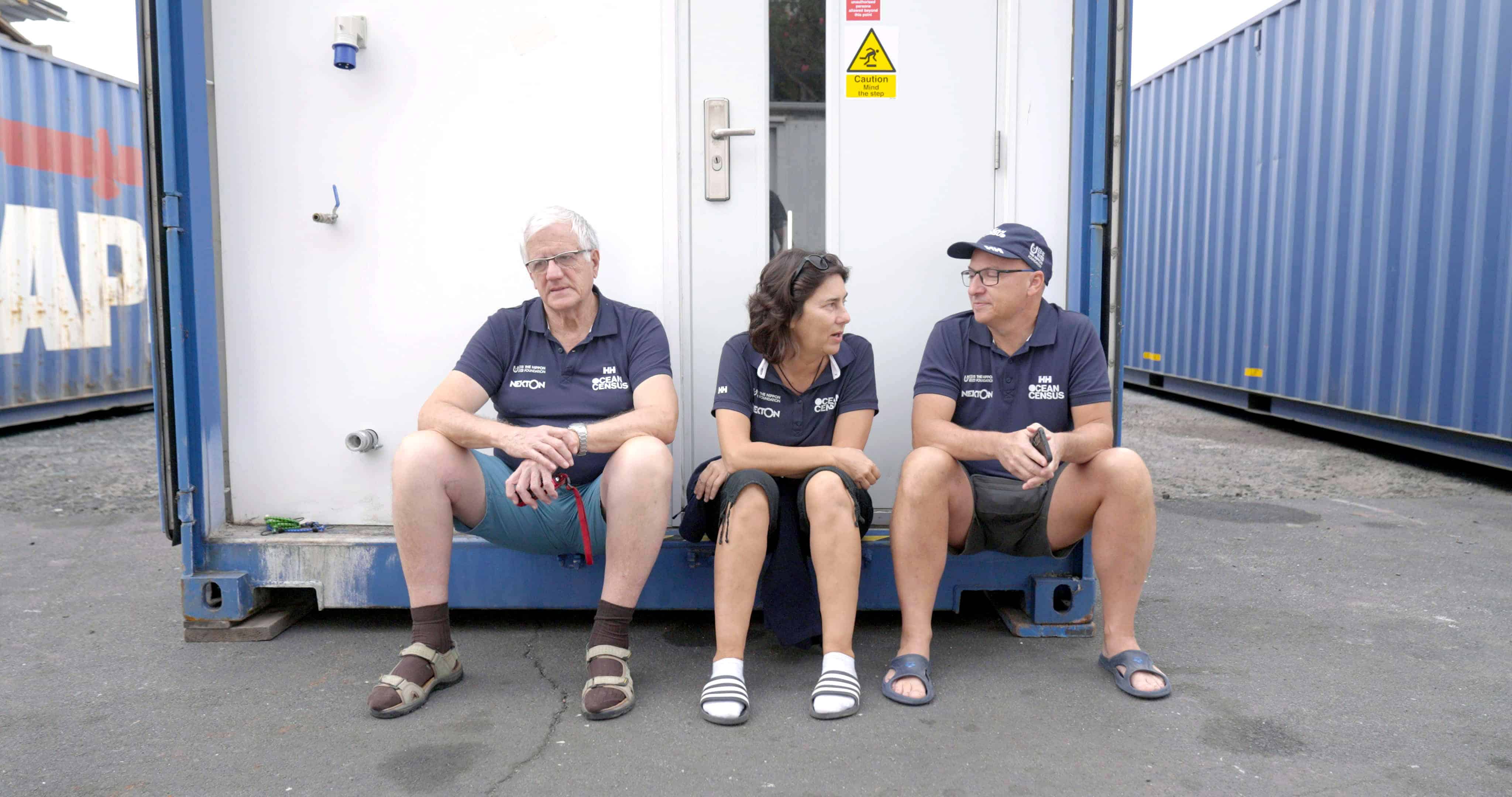 Jesus, Leo and Carmen sitting in front of container lab