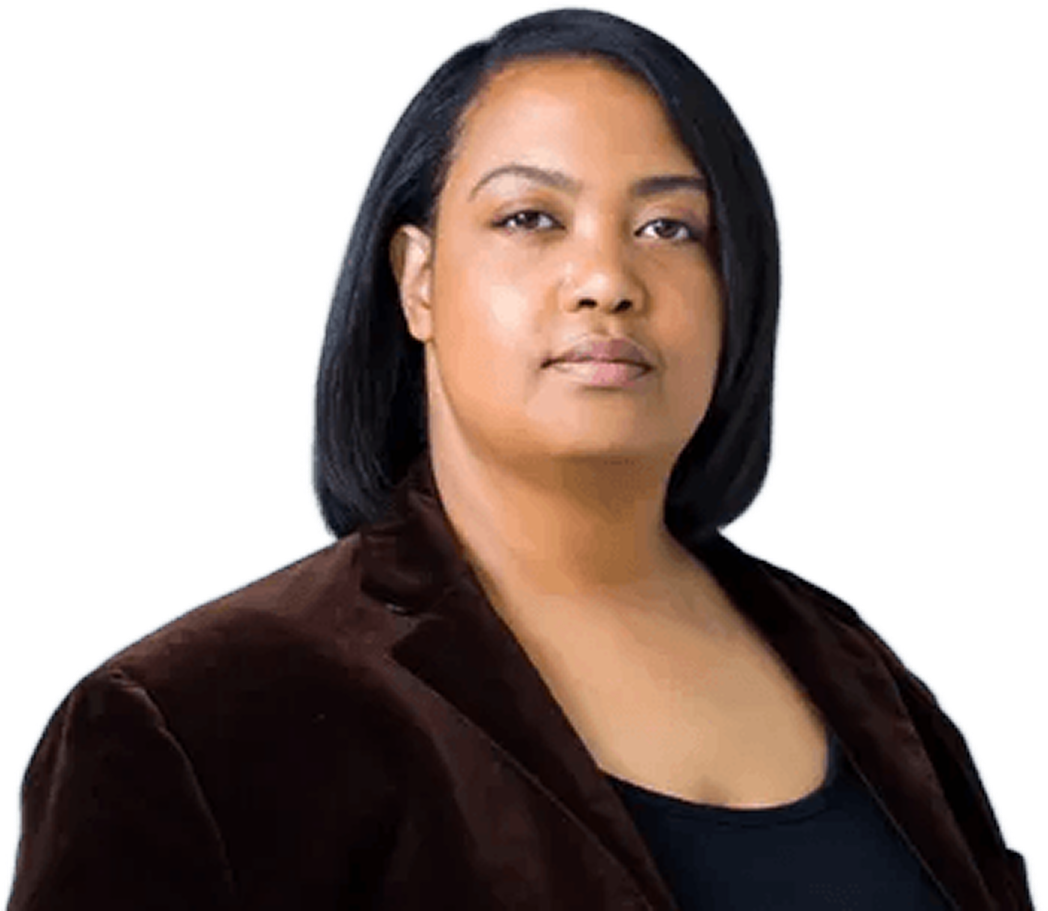 Portrait of a woman with straight black hair wearing a dark brown blazer and black top, looking confidently at the camera.